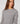 Jersey de manga larga con peplum - Gris